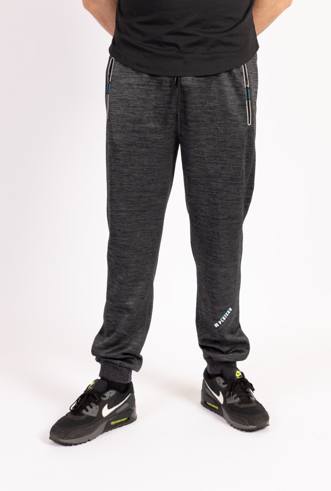 Front view of No Plateau Grey Joggers with reflective detailing.